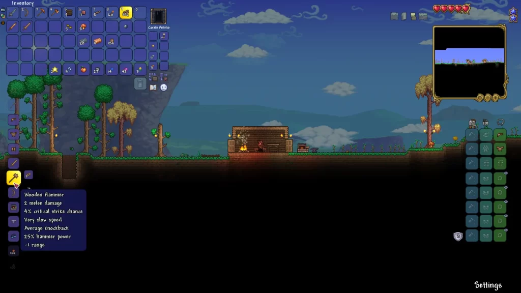 crafting a wooden hammer at a workbench in terraria