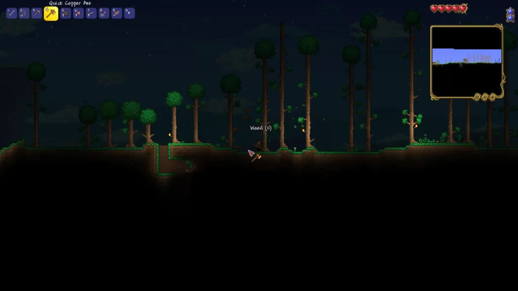 cutting a tree down at the base in terraria, causing wood to fall