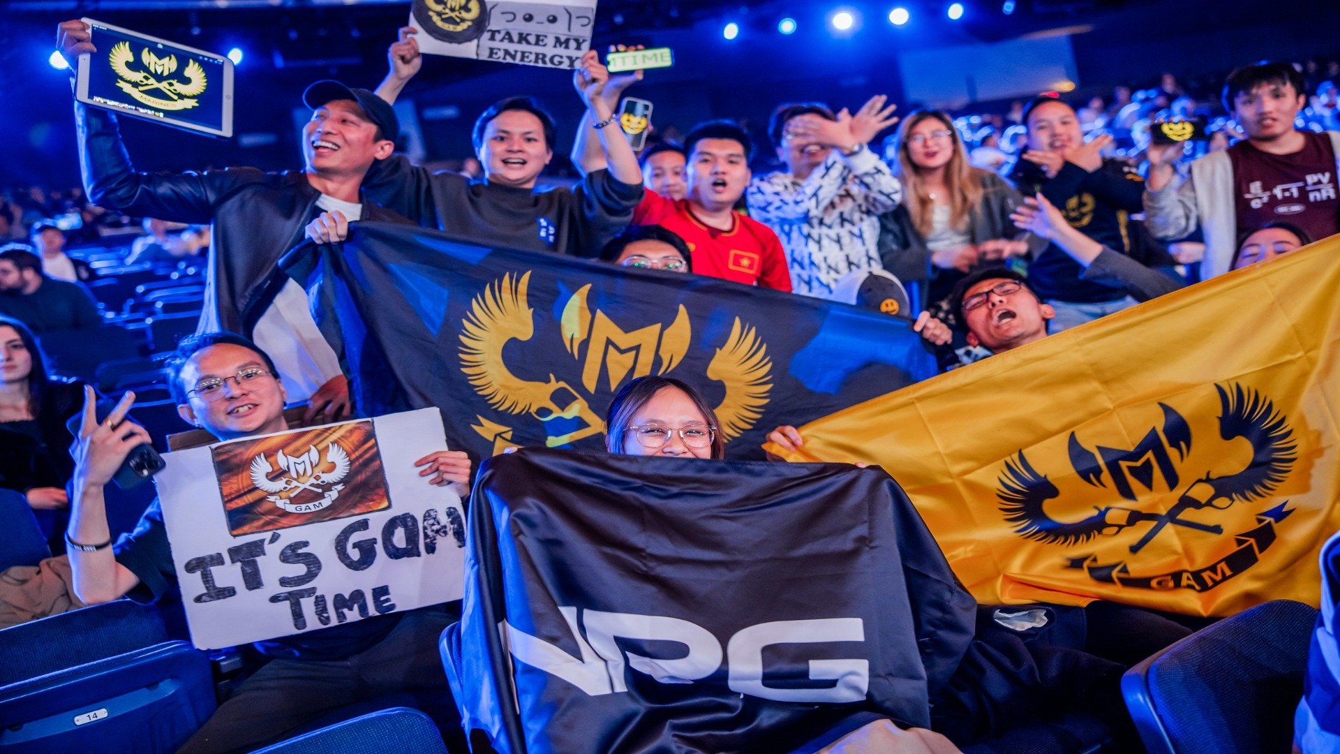 Fans of GAM Esports posing in the crowd during Worlds Groups day four