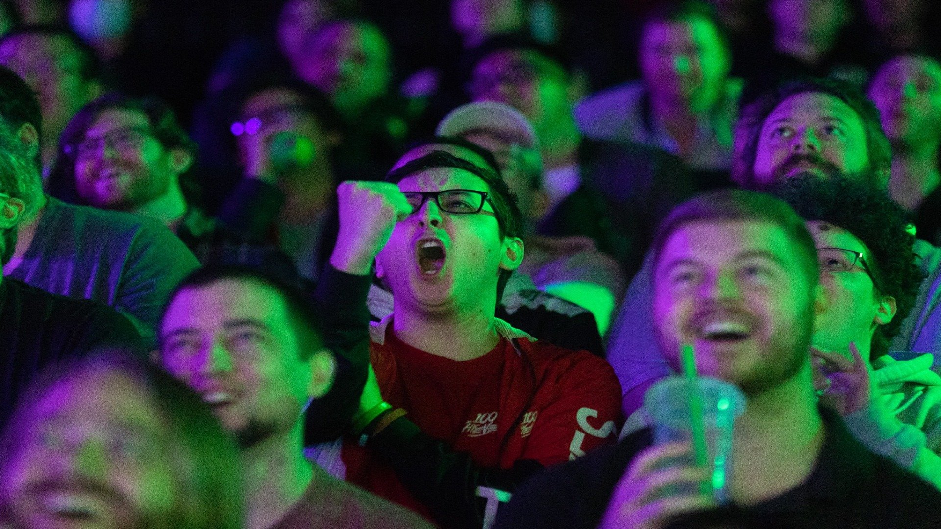 A 100 Thieves fan cheering during the 2023 LCS Spring Split day five